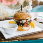 foodiesfeed.com_juicy-burger-in-a-vibrant-interior
