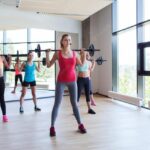 fitness-sport-training-gym-lifestyle-concept-group-women-excercising-with-bars-gym_380164-85630-1024×651