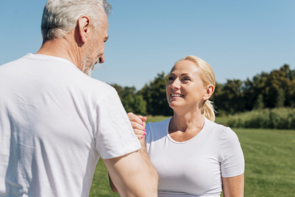 Smiling couple walking outside with energised mood